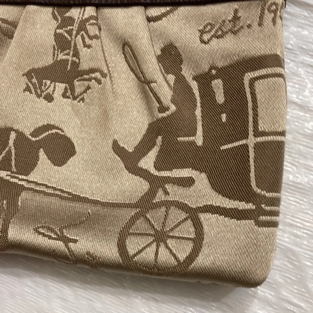 Coach carriage brown wristlet bag